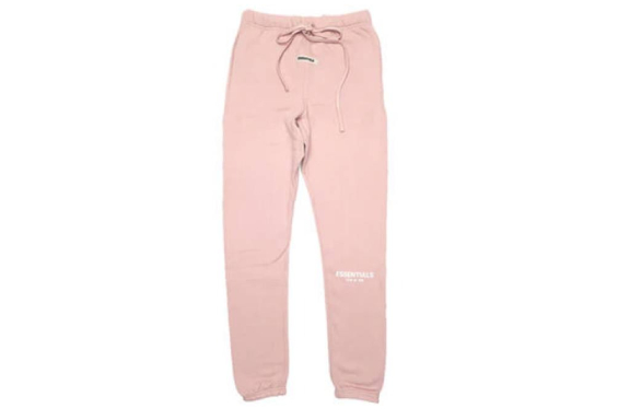 The Fear Of God Essential Reflective Tracksuit in Pink captures the essence of contemporary fashion, offering a mix of reflective accents and chic allure
