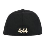 Cap's color combination, the collaboration between Fear of God and Jay-Z, the fitted cap style, and any unique features to assist those who rely on text descriptions for visual content.